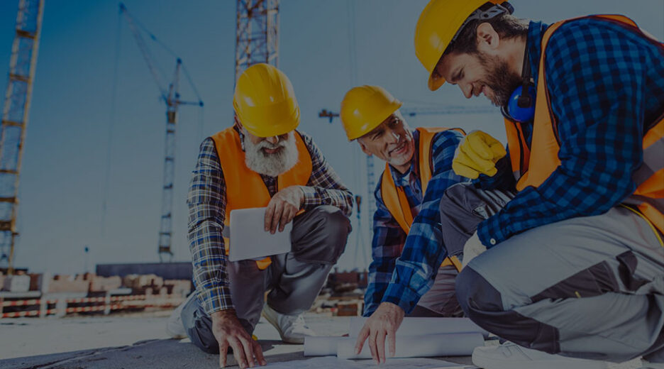 Trades reviewing drawings on site