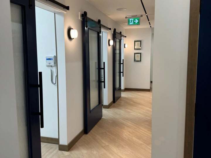 Finished clinic corridor with treatment room doors